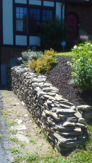 Hand laid stone retainer wall